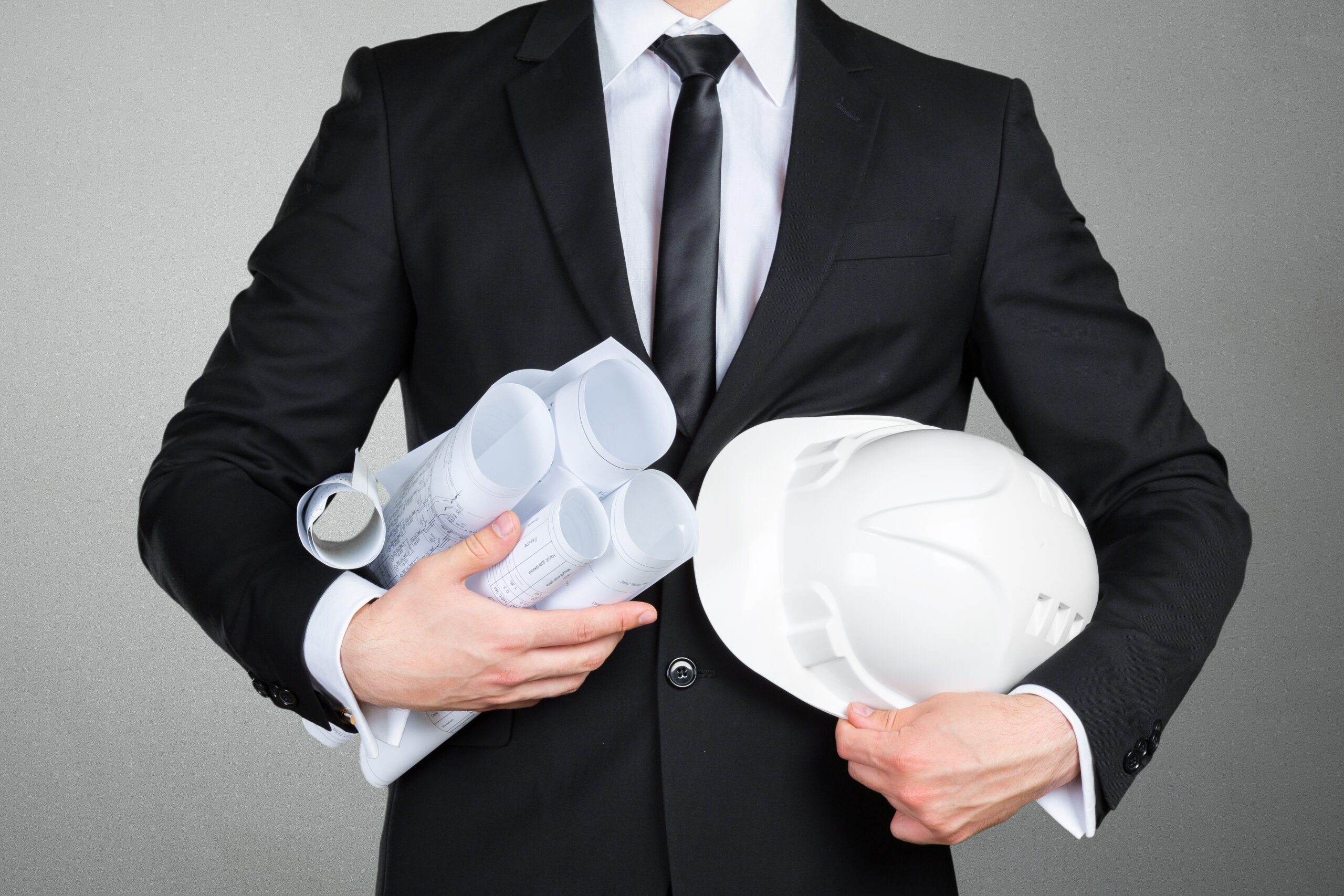 Close up of  engineer  holding blueprints